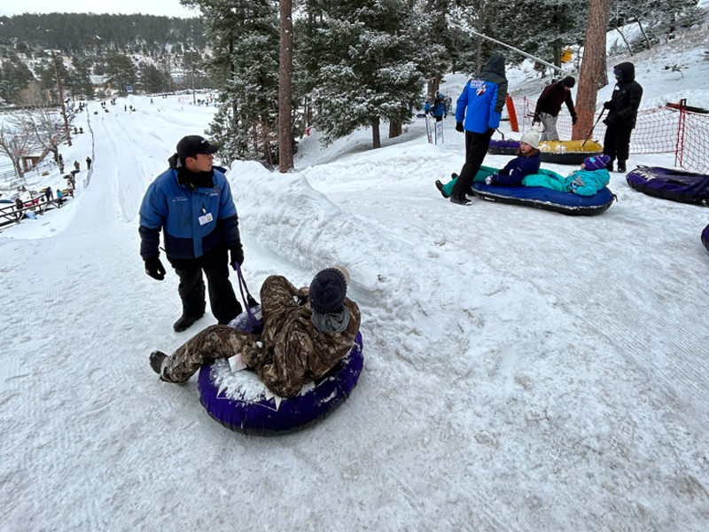 people tubing during the winter 2